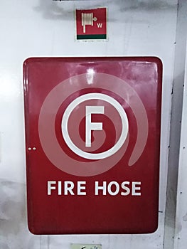 FireÃ¢â¬â¹ hoseÃ¢â¬â¹ boxÃ¢â¬â¹ withÃ¢â¬â¹ symbol photo